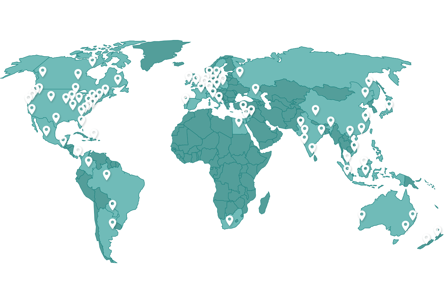 A world map in shades of green with white location pins marking various countries across all continents, showcasing Ackley Hartnett’s global presence. Text at the bottom reads, “1,000+ Machines in over 50 Countries.”.