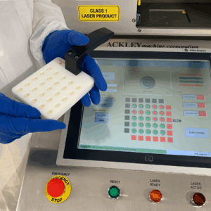 R&D Laser Drilling Machine with paddle and capsules and touchscreen behind
