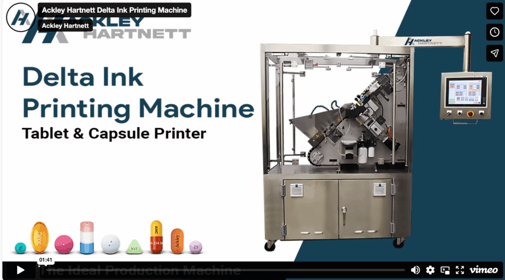Screenshot of a video titled "Delta Ink Printing Machine Tablet & Capsule Printer" by Ackley Hartnett, showing a large industrial machine and colorful capsules and tablets along the bottom.